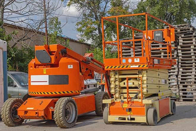 heavy-duty forklift maneuvering through a busy warehouse in Belvidere